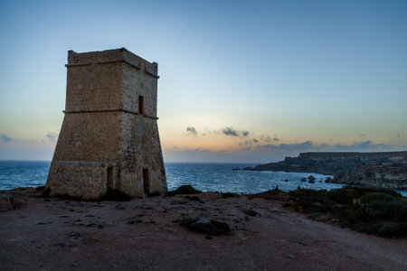 Ghajn Tuffieha Tower in Golden Bay at sunset - Maltaのeditorial素材