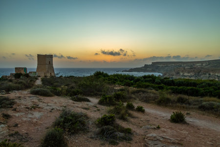 Ghajn Tuffieha Tower in Golden Bay at sunset - Maltaのeditorial素材