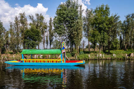 Colorful boat (also known as trajinera) at Xochimilco's Floating Gardens - Mexico City, Mexicoの写真素材