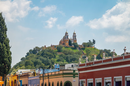 Street of Cholula and Church of Our Lady of Remedies at the top of Cholula pyramid - Cholula, Puebla, Mexicoのeditorial素材