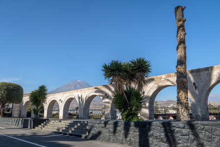 The Arches of Yanahuara Plaza and Misti Volcano on Background - written on the arches are quotes of famous people of the city - Arequipa, Peruの写真素材