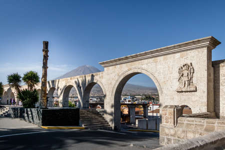 The Arches of Yanahuara Plaza and Misti Volcano on Background - written on the arches are quotes of famous people of the city - Arequipa, Peruの写真素材