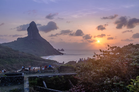 Sunset View from Our Lady of Remedios Fortress with Morro do Pico on background - Fernando de Noronha, Pernambuco, Brazilのeditorial素材