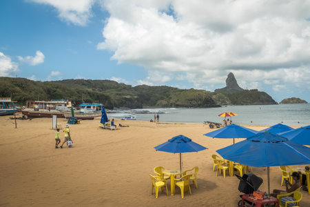 Porto Beach and Santo Antonio Beach Port with Morro do Pico on backgorund - Fernando de Noronha, Pernambuco, Brazilのeditorial素材