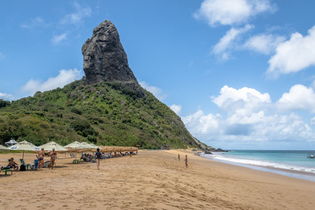 Beach Umbrellas at Praia da Conceicao Beach and Morro do Pico - Fernando de Noronha, Pernambuco, Brazilのeditorial素材