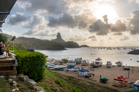 Sunset view of Porto and Port of Santo Antonio with Pico on background from Mergulhao Restaurant - Fernando de Noronha, Pernambuco, Brazilのeditorial素材