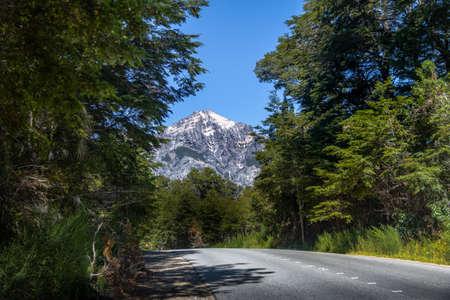 CIrcuito Chico hiking road with snowtopped Mountain on background - Bariloche, Patagonia, Argentinaの写真素材