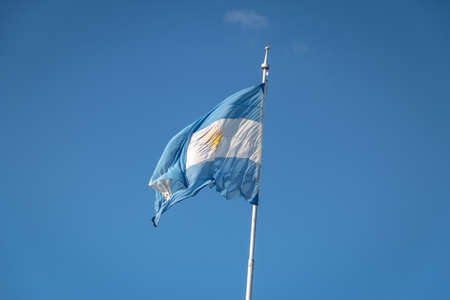 Argentina Flag on a blue sky backgroundの写真素材