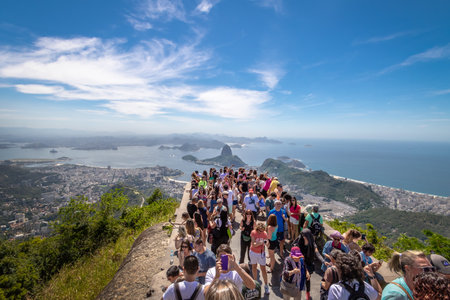 Rio de Janeiro, Brazil - Nov 2, 2017: Tourists at Christ the Redeemer Statue with an aerial view of Guanabara Bay and Sugar Loaf Mountain - Rio de Janeiro, Brazilのeditorial素材