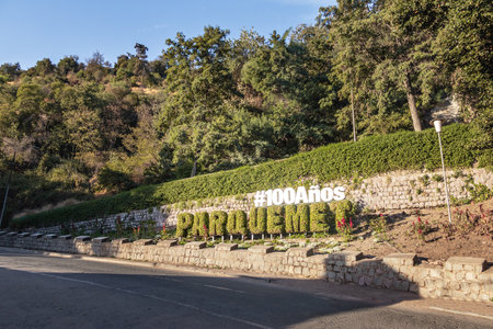 Street leading to San Cristobal Hill and Santiago Metropolitan Park sign - Santiago, Chileのeditorial素材