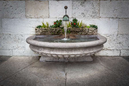 Stone water fountain in Geneva Old Town - Geneva, Switzerlandの写真素材