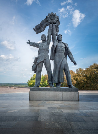 Russian and Soviet workers holding the Soviet Order of Friendship of Peoples Monument under People's Friendship Arch - Kiev, Ukraineのeditorial素材