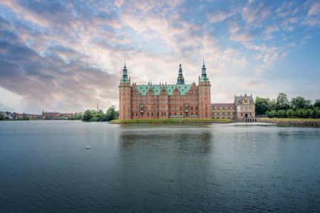 Frederiksborg Castle and Castle Lake at sunset - Hillerod, Denmarkのeditorial素材