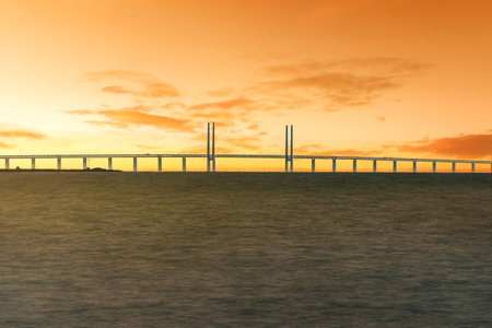 Oresund Bridge connecting Denmark and Sweden at sunset - Malmo, Swedenのeditorial素材
