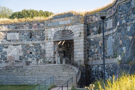 King's Gate in Suomenlinna Fortress - Helsinki, Finland - Text says: Suomenlinna that touches the sea on one side and the beach on the other is the wise.のeditorial素材