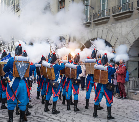 Bern, Switzerland - Nov 25, 2019: Smoke of Firegun shots fired by swiss soldiers on traditional costume during a Parade on Zibelemarit Holiday (Onion Market) - Bern, Switzerlandのeditorial素材