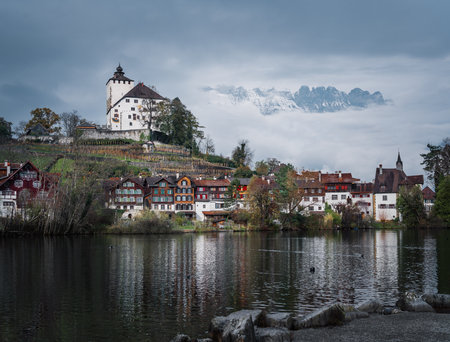 Skyline of Buchs with Werdenberg Castle, Werdenberg Lake and Alps Mountains on background - Buchs, Switzerlandのeditorial素材
