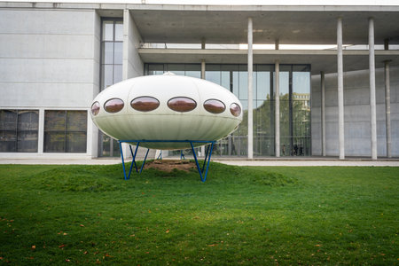 Munich, Germany - Nov 01, 2019: Futuro House (designed by Matti Suuronen in 1968) in front of Pinakothek der Moderne - Munich, Bavaria, Germanyのeditorial素材