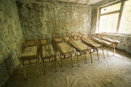 Chernobyl, Ukraine - Aug 07, 2019: Cribs at the Nursery of Pripyat Hospital - Pripyat, Chernobyl Exclusion Zone, Ukraineのeditorial素材