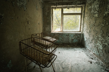 Chernobyl, Ukraine - Aug 07, 2019: Cribs at the Nursery of Pripyat Hospital - Pripyat, Chernobyl Exclusion Zone, Ukraineのeditorial素材