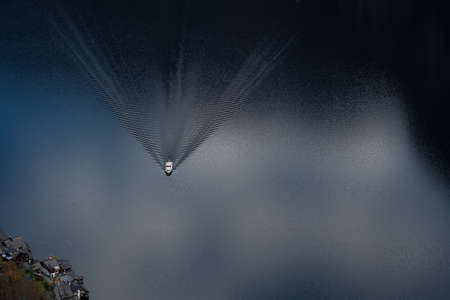 Aerial Top-Down View of Ferry Boat on Lake Hallstatt - Hallstatt, Austriaの写真素材