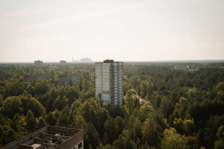 Aerial view of Pripyat and Chernobyl Exclusion Zone with Chernobyl Nuclear Power Plant Reactor 4 New Safe Confinement on background - Pripyat, Chernobyl Exclusion Zone, Ukraineの写真素材