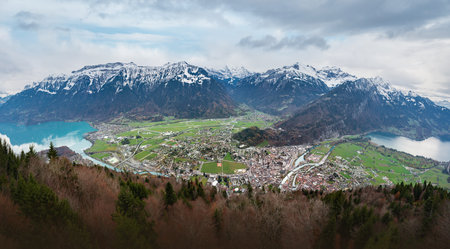 Panoramic aerial view of Interlaken and Unterseen between Lakes Thun and Brienz with Bernese Alps...
