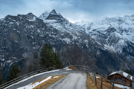 Road in Murren with Jungfrau Mountain on background - Silberhorn and Schwarz Monch parts - Murren, Switzerlandの写真素材