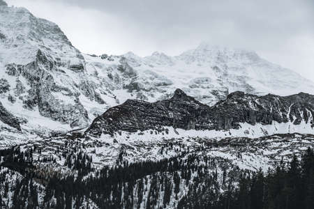 Bernese Alps Mountains with Grosshorn  e Breithorn peaks with a foggy haze - Murren, Switzerlandの写真素材