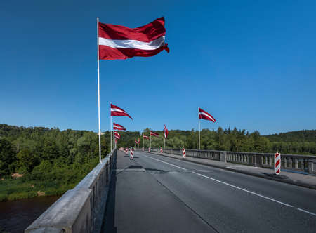 Bridge over Gauja River with Latvian Flags - Sigulda, Latviaの写真素材
