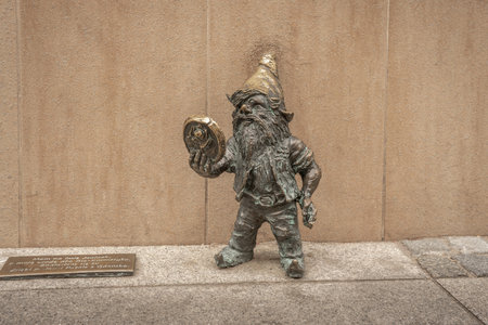 Wroclaw, Poland - Aug 20, 2019: Jany dwarf with a mirror (Janinek) - since 2005 hundreds of wroclaw dwarf figurines appeared in the city - Wroclaw, Polandのeditorial素材
