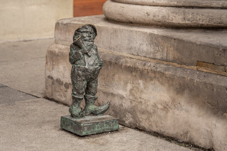 Wroclaw, Poland - Aug 21, 2019: Broker dwarf (Gieldus) - since 2005 hundreds of wroclaw dwarf figurines appeared in the city - Wroclaw, Polandのeditorial素材