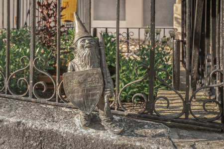 Wroclaw, Poland - Aug 21, 2019: Ursus dwarf with a shield - since 2005 hundreds of wroclaw dwarf figurines appeared in the city - Wroclaw, Polandのeditorial素材