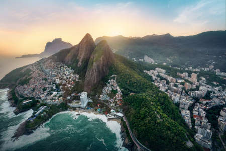 Aerial view of Dois Irmaos Mountain (Morro Dois Irmaos) with Vidigal and Leblon at sunset - Rio de...