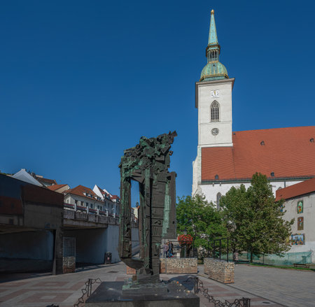 Bratislava, Slovakia - Oct 14, 2019: Pamataj Sculpture (Remember) with St. Martin Cathedral on background - Memorial to the Victims of Holocaust by Milan LukÃ¡Ä , 1996 - Bratislava, Slovakiaのeditorial素材