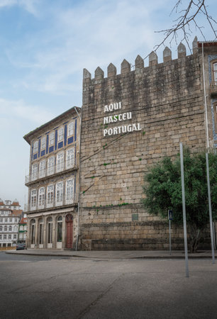 Guimaraes, Portugal - Feb 9, 2020: Portugal Was Born Here sign at Alfandega Tower - Guimaraes,...