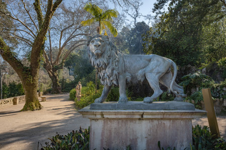 Sintra, Portugal - Feb 21, 2020: Lion Statue at Gods Promenade of Quinta da Regaleira gardens -...