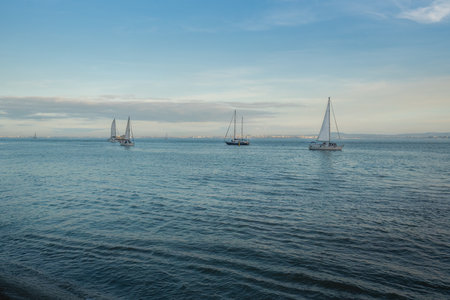 Sailboats at Tagus River (Rio Tejo) - Lisbon, Portugalの写真素材