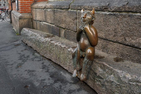 Lubeck, Germany - Jan 10, 2020: Devil on the Devil Stone Sculpture in front of St. Mary Church (Marienkirche) - Lubeck, Germanyのeditorial素材