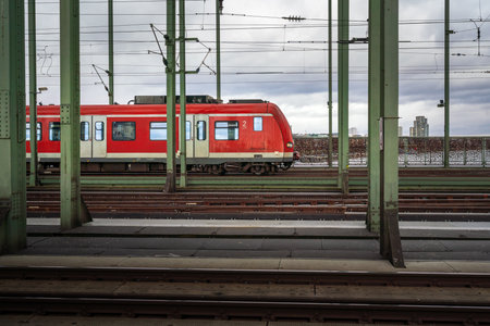 Red Train at Hohenzollern Bridge - Cologne, Germany