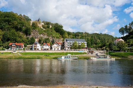 Rathen, Germany - Sep 19, 2019: Elbe river and Rathen city skyline with Ferryboat - gateway to Bastei Bridge (Basteibrucke) - Saxony, Germanyのeditorial素材