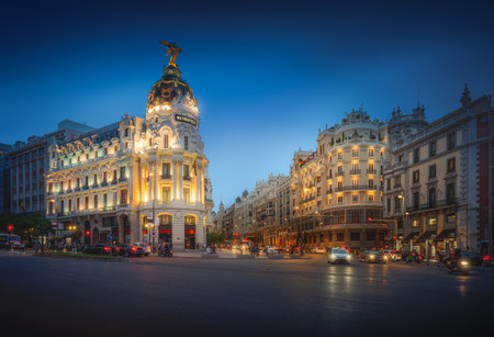 Madrid, Spain - Jun 17, 2019: Calle de Alcala and Gran Via Streets at night with Edificio Metropolis Building - Madrid, Spainのeditorial素材