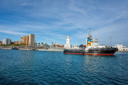 Ship at Muelle Uno with Malaga Lighthouse - Malaga, Andalusia, Spainの写真素材