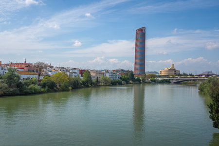 Guadalquivir River and Sevilla Tower (Torre Sevilla) - Seville, Andalusia, Spainの写真素材