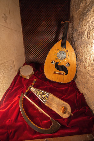 Cordoba, Spain - Jun 11, 2019: Arab out, Rebab and Daf - Andalusian Musical instruments at Alive Museum of Al-Andalus in Calahorra Tower - Cordoba, Andalusia, Spainのeditorial素材