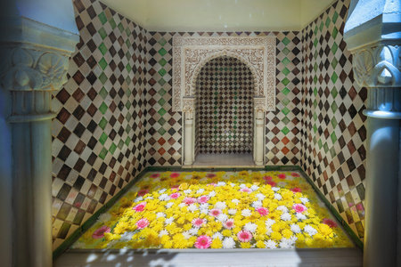 Cordoba, Spain - Jun 11, 2019: Carved Fountain with flowers at Casa Andalusi (House of Andalusia) - Cordoba, Andalusia, Spainのeditorial素材