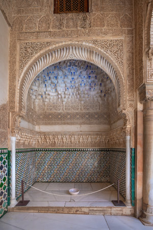 Granada, Spain - Jun 5, 2019: Ornate Niche at Court of the Myrtles (Patio de los Arrayanes) in Comares Palace at Nasrid Palaces of Alhambra - Granada, Andalusia, Spainのeditorial素材