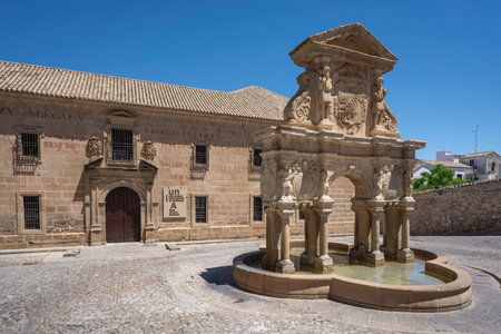 Baeza, Spain - Jun 2, 2019: Santa Maria Fountain and San Felipe Neri Conciliar Seminary at Plaza de Santa Maria Square - Baeza, Jaen, Spainのeditorial素材