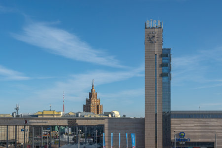 Riga, Latvia - Jul 14, 2019: Central Station Clock Tower and Latvian Academy of Sciences - Riga, Latviaのeditorial素材