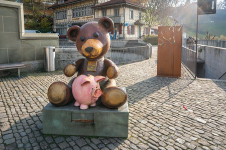Bern, Switzerland - Nov 25, 2019: Bear Statue for donations at BarenPark and Bear Pit - Bern, Switzerlandのeditorial素材